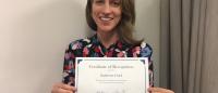 Katherine Clark holding her certificate